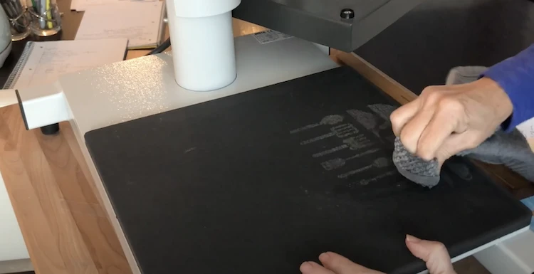 Disgruntled heat press user accidentally transfers ink onto the upper platen.