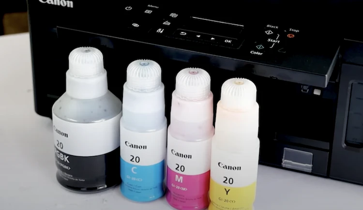 Sublimation ink inside plastic bottles ready to be used as refills.