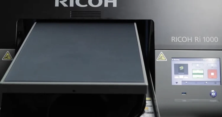 Richoh Ri 1000 direct to garment printer in matt black color.